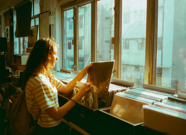 Woman buying vinyl in record store