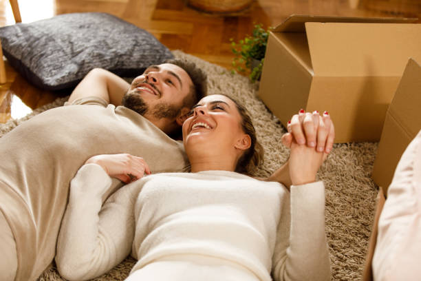 istock Couple taking a break from unpacking in their new home 2123679798