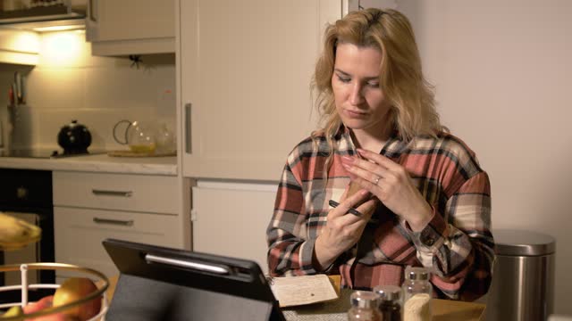 Woman making checklist of condiments and species