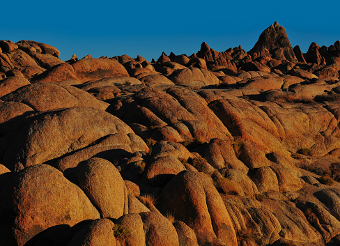 Sunrise on rounded boulders in the Alabama Hills National Scenic Area, Lone Pine, Eastern Sierra, California, USA.