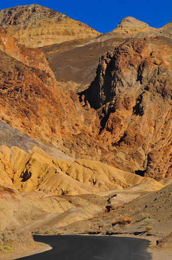 The Artists Drive scenic road winding through multi-coloured geology, Death Valley National Park, California, USA.