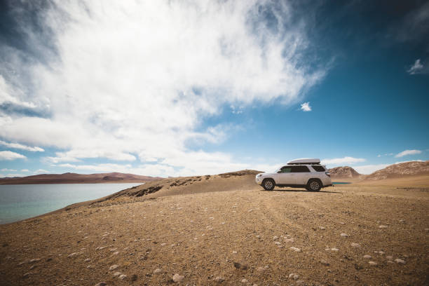 Driving off road car on the high altitude landside mountains Driving off road car on the high altitude landside mountains Haval H9 SUV stock pictures, royalty-free photos & images