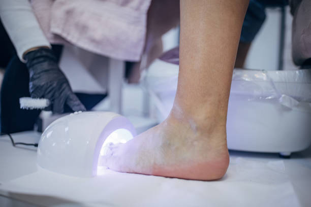 istock Pedicure procedure with uv nail lamp in salon 2123746183