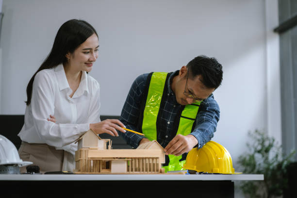 istock Engineer Teamwork Meeting, Drawing working on blueprint meeting for project working with partner on model building at company office. Asian industry professional team 2123816757