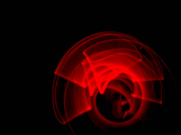 istock Red light painting, long exposure photography, ripples and round pattern 2123862305