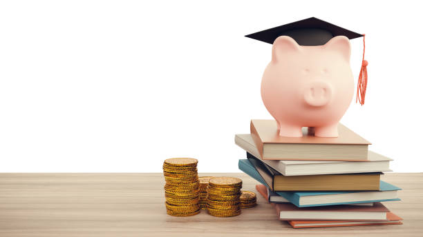 istock Graduation cap with piggy bank on books and coins stack. 3D Render. 2123930821
