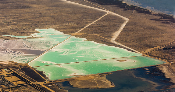 Solar salt pans at Laguna Ojo de Liebre on the Pacific Ocean side of Baja California Sur. Mexico. Vizcaíno Biosphere Reserve UNESCO World Heritage Site. Salt evaporation ponds.