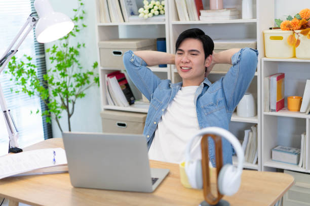 istock Young Asian businessman working at home 2123969698