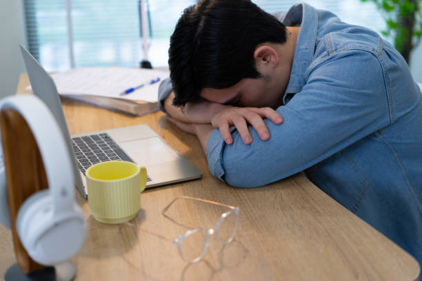 istock Young Asian businessman working at home 2123970220