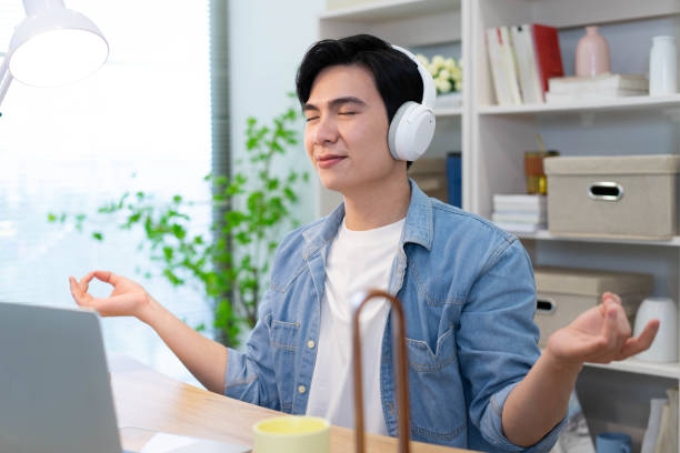 istock Young Asian businessman working at home 2123970730