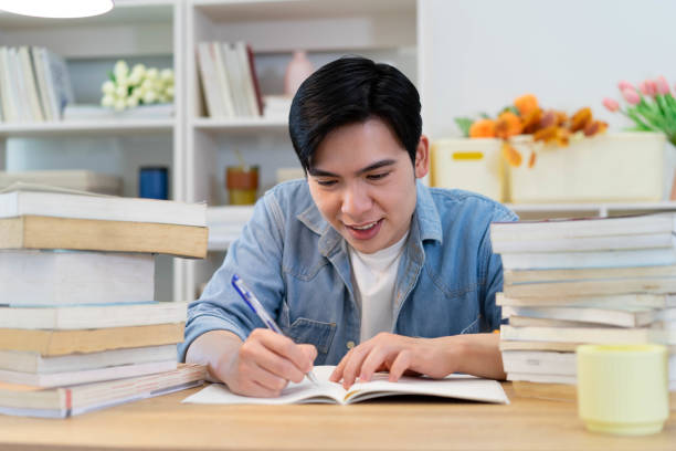 istock Young Asian businessman working at home 2123971824
