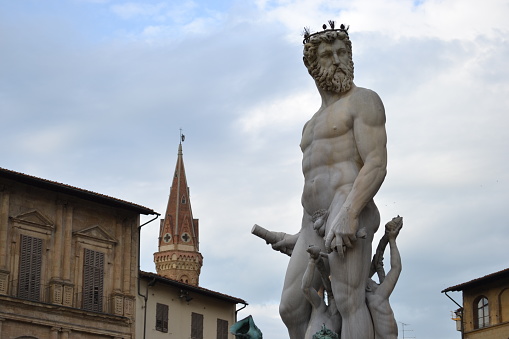 Florence, Italy - December 22, 2017: Leonardo Da Vinci statue, by Luigi Pampaloni, 1839. It is located in the Uffizi courtyard, in Florence.