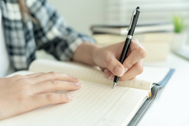istock Student, use left-handed, inspiration, writer, writing ,creative ,recreation for imagine, writing ideas on notebook, to do list, good thinking work, journalist, Stylish, Dream image, relax, designer 2124029369