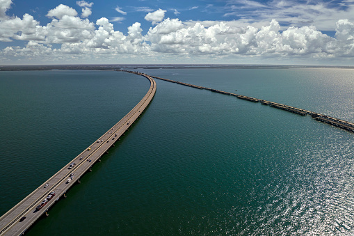 Aerial view of Sunshine Skyway Bridge over Tampa Bay in Florida with moving traffic. Concept of transportation infrastructure.