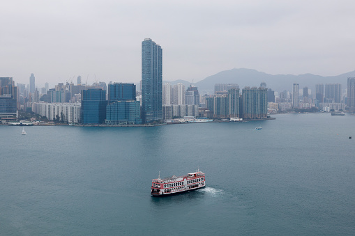 2024 Mar 3,Hong Kong.Aerial view of the Victoria Harbour,Faraway is Whampoa Garden,Hung Hom district,