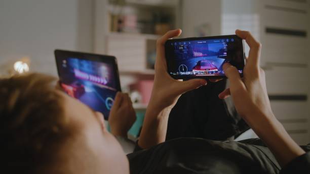 istock Sister spending leisure time with her brother playing games 2124200155
