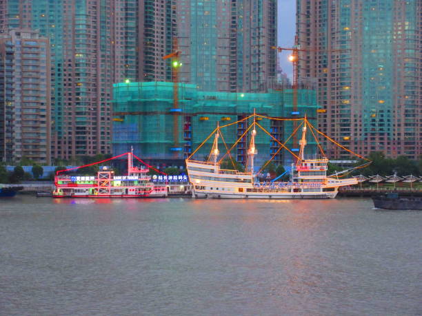 Pudong skyline from The Bund with Oriental Pearl Tower and skyscrapers during daytime