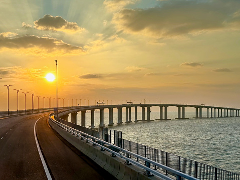 HZMB (Hong kong Zhuhai Macau Bridge) the longest bridge in the world spanning accross 50 km above and under the ocean. Connecting Hong Kong SAR, Macau SAR, and Zhuhai (China). Taken during beautiful sunset.