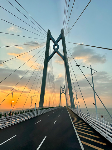 HZMB (Hong kong Zhuhai Macau Bridge) the longest bridge in the world spanning accross 50 km above and under the ocean. Connecting Hong Kong SAR, Macau SAR, and Zhuhai (China). Taken during beautiful sunset.