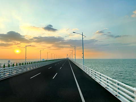 HZMB (Hong kong Zhuhai Macau Bridge) the longest bridge in the world spanning accross 50 km above and under the ocean. Connecting Hong Kong SAR, Macau SAR, and Zhuhai (China). Taken during beautiful sunset.