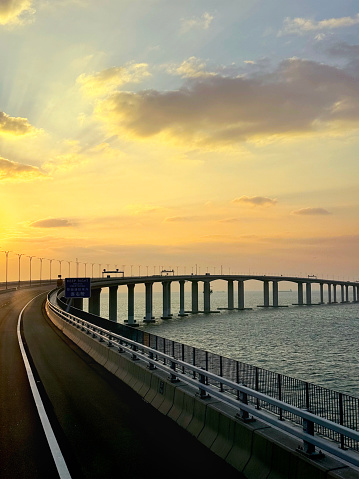 HZMB (Hong kong Zhuhai Macau Bridge) the longest bridge in the world spanning accross 50 km above and under the ocean. Connecting Hong Kong SAR, Macau SAR, and Zhuhai (China). Taken during beautiful sunset.