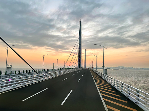 HZMB (Hong kong Zhuhai Macau Bridge) the longest bridge in the world spanning accross 50 km above and under the ocean. Connecting Hong Kong SAR, Macau SAR, and Zhuhai (China). Taken during beautiful sunset.