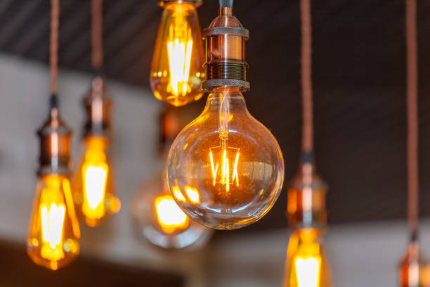 istock Decorative antique edison style filament light bulbs hanging from ceiling 2124291902