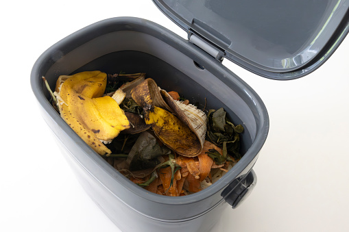 Kitchen composting container used to hold food scraps for composting