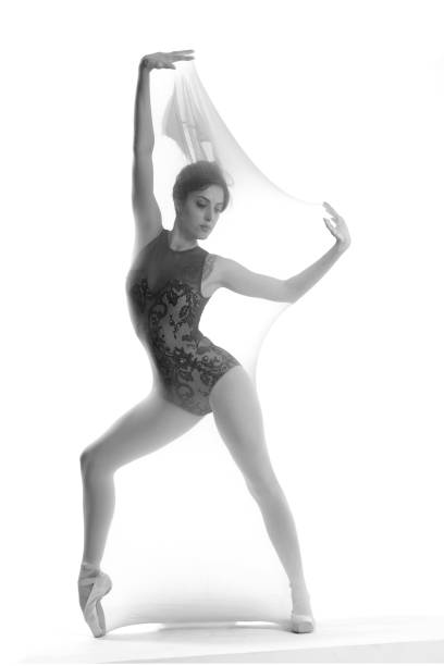 Beautiful ballerina is dancing with transparent socks