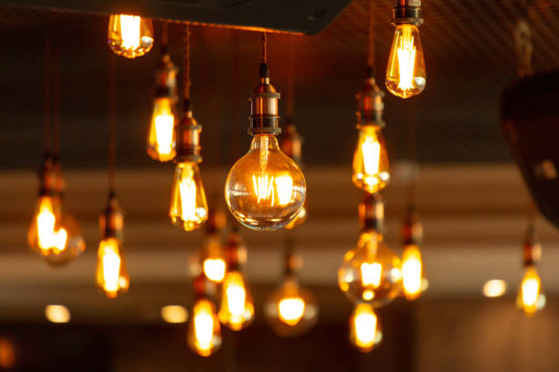 istock Decorative antique edison style filament light bulbs hanging from ceiling 2124316612
