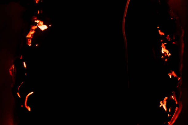 istock burning paper, glowing edge of paper 2124341448