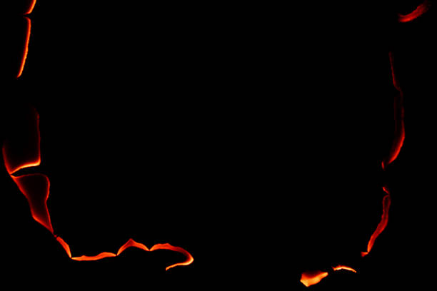 burning paper, glowing edge of paper on a black background