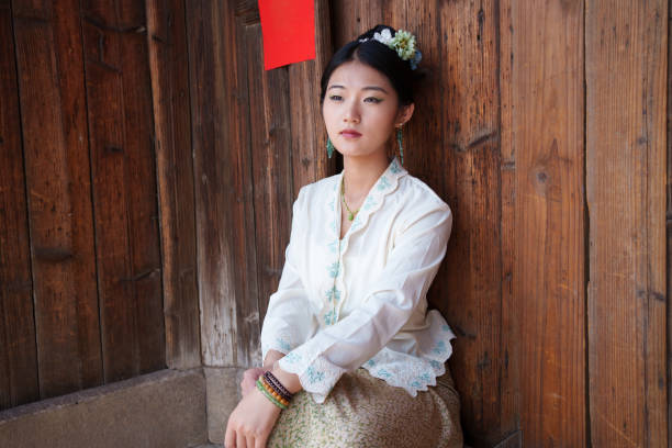 young woman sitting on threshold