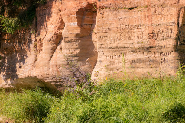 istock beautiful day on the river, sandstone cliffs and tree reflections in the water, blue sky reflected in the river water 2124351801