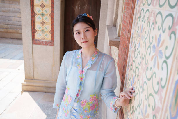 istock Asian woman holding hands on wall 2124360061