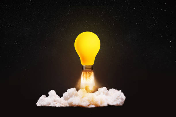 istock Creative light bulb rocket with blast and smoke takes off on a black background, concept. Successful launch, creative idea. Think differently. Creative generator. Smart and thinking 2124376463