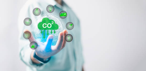 istock Reduce CO2 emission concept in hand for environmental, global warming, Sustainable development and green business based on renewable energy. Industrial emissions pollute environment and ecosystems. 2124414702