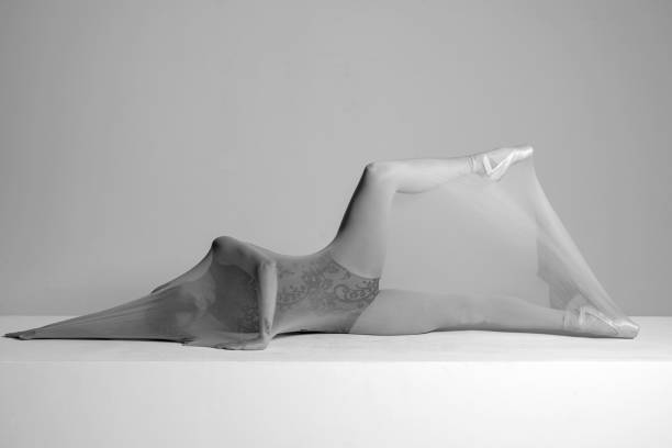 Beautiful ballerina is dancing with transparent socks