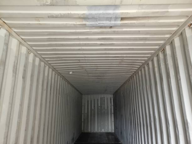 istock Container trucks, also called container trucks, are container transport vehicles consisting of a towing vehicle and an attached carriage on which the container is placed. 2124465790