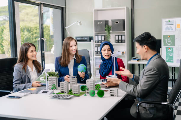 istock Group of alternative energy engineers discussing a project with a worker businesspeople a meeting in solar cell panel and Solar Energy Environment city 2124476682