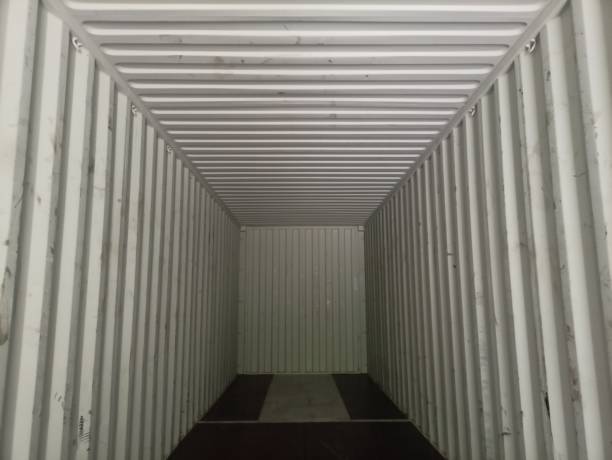 istock Container trucks, also called container trucks, are container transport vehicles consisting of a towing vehicle and an attached carriage on which the container is placed. 2124479301