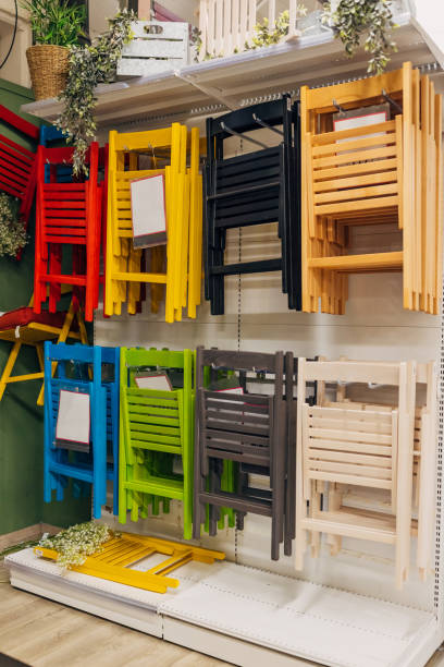 Folding chairs of different colors displayed in a department store