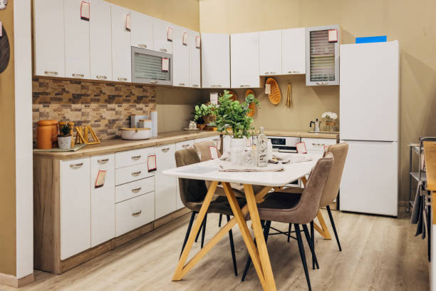 istock Kitchen on display in a department store. Large storage space, cabinets and drawers allow organization and keep the space neat and tidy 2124500341