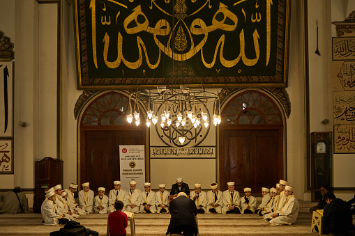 People gathered in mosque in Ramadan and listening to the preacher