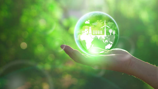 istock Reduce CO2 emission concept in the hand for environmental, global warming, Sustainable development and green business based on renewable energy.CO2 icon on green leaf with water droplet. 2124574825