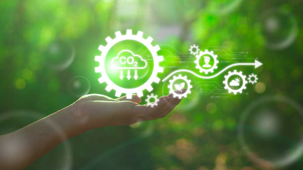 istock Reduce CO2 emission concept in the hand for environmental, global warming, Sustainable development and green business based on renewable energy.CO2 icon on green leaf with water droplet. 2124575194