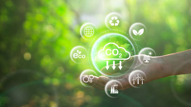 istock Reduce CO2 emission concept in the hand for environmental, global warming, Sustainable development and green business based on renewable energy.CO2 icon on green leaf with water droplet. 2124575197