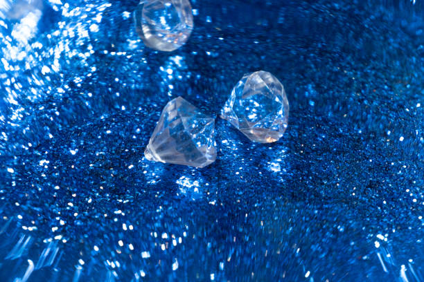 Sliver diamond jewellery on glittering background
