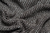 Wrinkled silver fabric that looks like chainmail