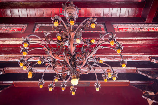 Vihara Gunung Timur Temple, Medan, Sumatra, Indonesia - January 16th 2024: Chandelier with modern electric bulbs in a hall of Confucius in a Buddhist temple
